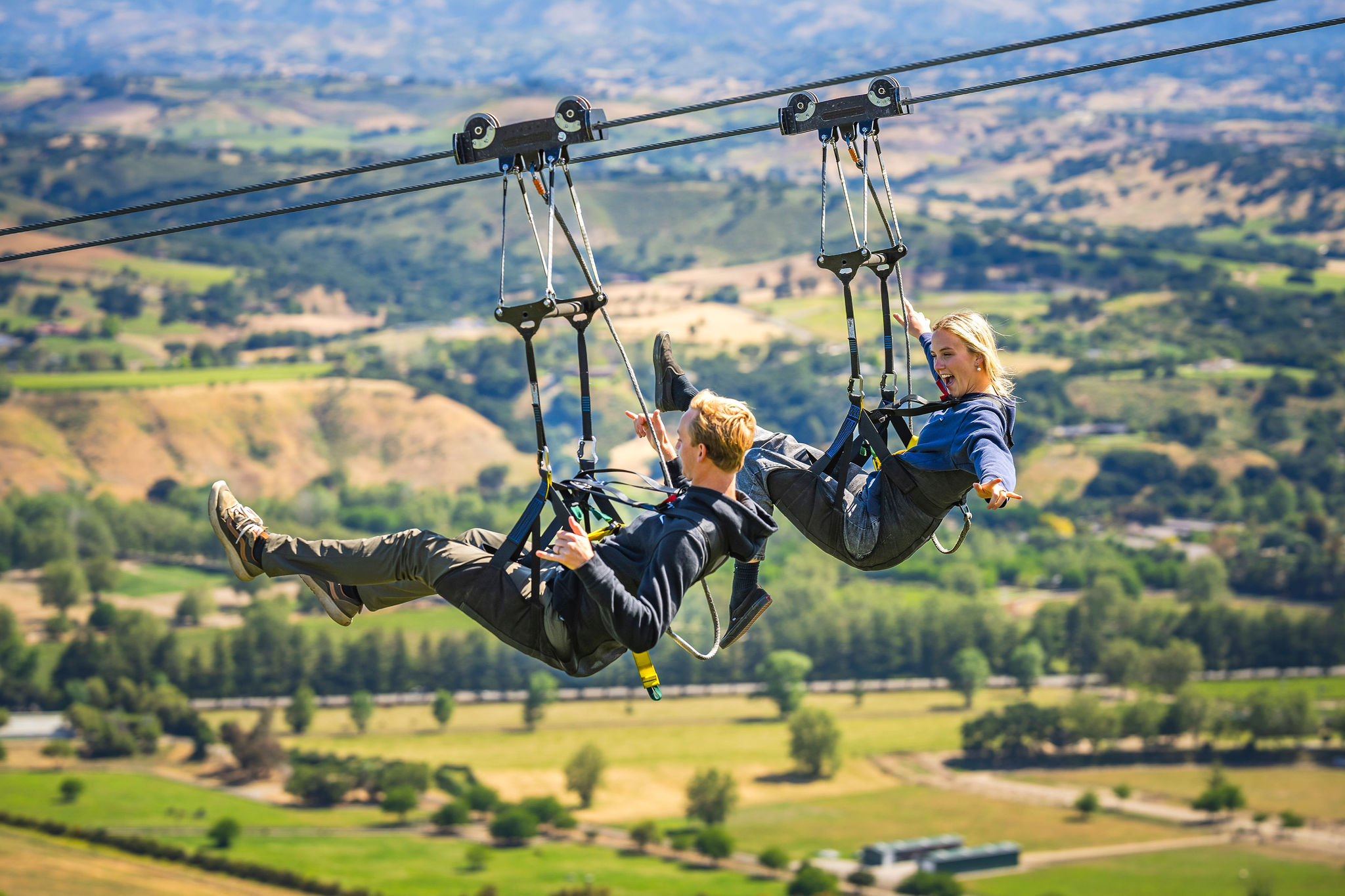 A guest ziplining high above the canyon at Highline Adventures.